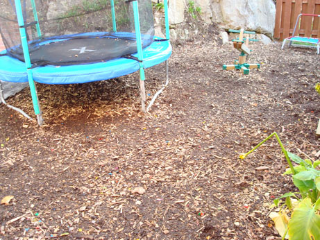Before and after replacing bark on children's play area by Homefix UK